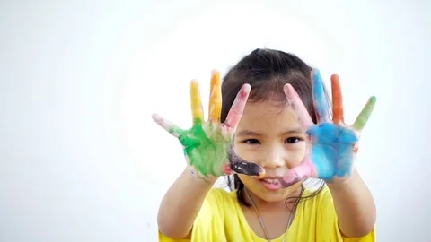 Close-up girl shows her hands to the camera. Portrait funny girl coloring Stock Footage