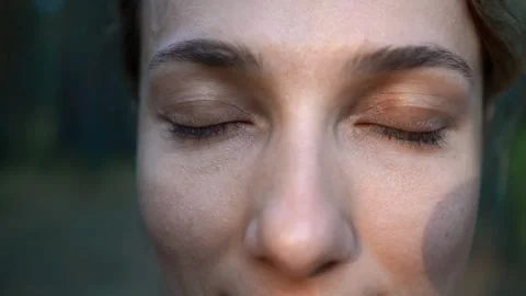 Close-up of a girl staring at the camera. Slow motion. Stock Footage 165202292