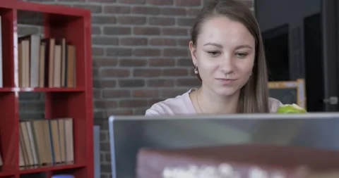 Close-up of girl using laptop, working for herself, remote work, short break Stock Footage 130778041