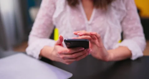 Close up girl is using a smartphone, checking email. A young beautiful Stock Footage 152343800