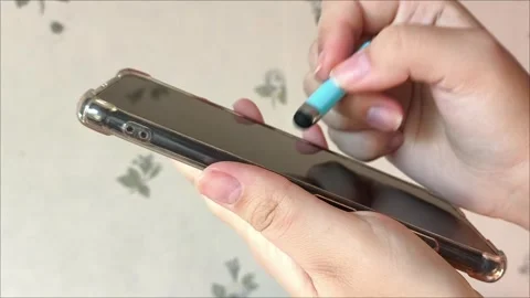 Close up, a girl using smartphone with holding stylus pen Stock Footage 313185019
