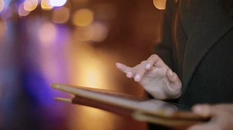 Close up of girl using a touch screen tablet on the street. Video stock 61521806