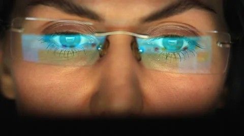 Close-up of girl's eyes looking at computer Stock Footage 59577406
