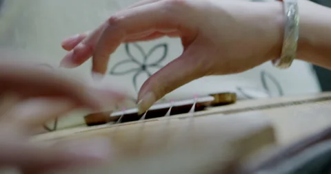 Close-Up Of girl's Hands Playing Old Vintage Lute String Instrument Stock Footage 133385910