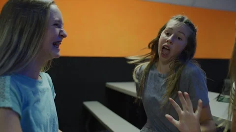 Close up of girls sitting at table singing and dancing to music / Orem, Utah, Stock Footage 96657085