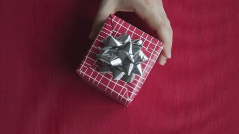 Close up giving red gift box isolated background. Christmas, Valentines,Birthday Video stock 121556518