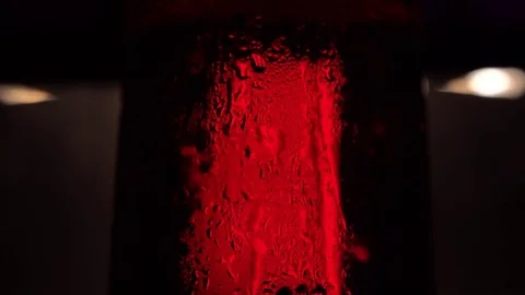 Close up. Glass of beer with bubbles in darkness Stock Footage 76718929