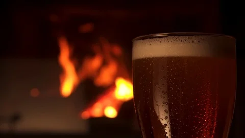 Close-up glass bocal of refreshment cooled beer with foam fireplace in 動画素材 103549549