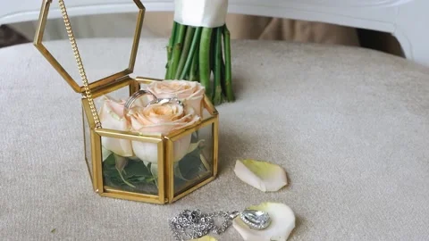 Close-up of a glass box with rings lying on it Stock Footage 153331719