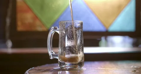 A close up of a glass cup on a table Stock Footage 155456368