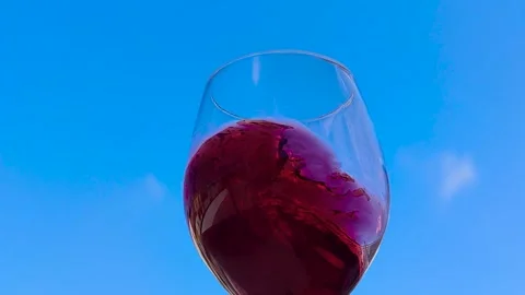 Close-up Glass of Red Wine. Creative Macro Slow Motion 4k Video of Red Wine. Stock Footage 240921111