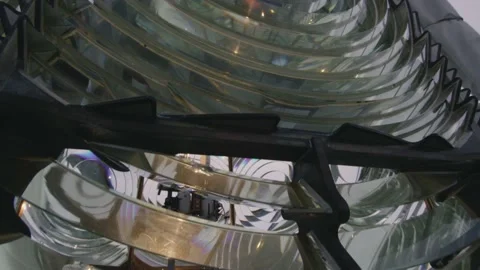 Close up of glass shape of lighthouse lens with light on during the day texture Video stock 148285018