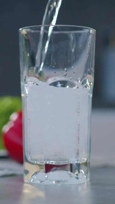 Close up glass standing on kitchen table and is poured with fresh milk. Healthy  Stock Footage 326467108