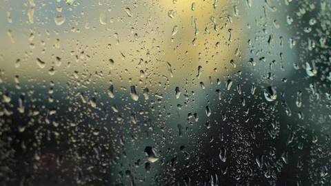 Close-up, on the glass there are large drops of rain, water, drops of water on a Stock Footage 90874902