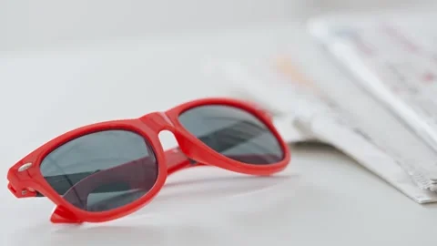 Close up on glasses and newspapers. Stock Footage 296549164