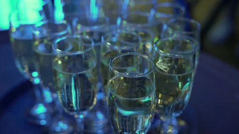 Close-up of a glasses with champagne on the buffet table in the restaurant hall Stock Footage 172393704