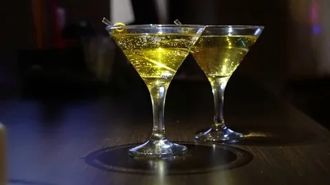 Close-up. glasses with martini or gin on the bar. Martini with olive. Stock Footage 126812037