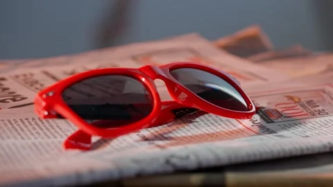 A close up of the glasses on the newspaper. Stock Footage 296549758