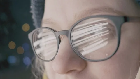 Close up of glasses with the reflection of lights in it Stock Footage 100713956