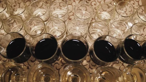 Close up of glasses of wine on a table during a wine tasting Stock Footage 98657561