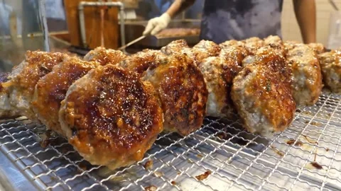 Close Up of Glazed Grilled Meatballs on Wire Rack Video stock 343587255