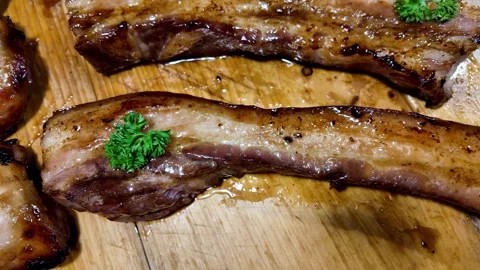 Close Up of Glazed Grilled Pork Ribs on a Wooden Board Vídeos de archivo 342945114