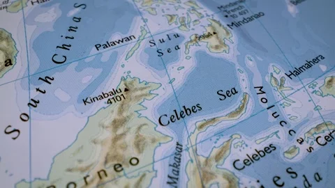Close up gliding shot toward borneo on a detailed relief map Stock Footage 341699051