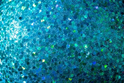 A close-up of a glittering blue surface, featuring hexagonal reflective par.. Stock Photos