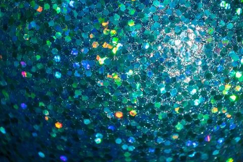 A close-up of a glittering blue surface, featuring hexagonal reflective par.. Stock Photos