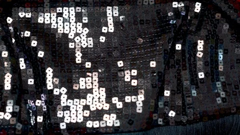 Close-up of glittering iridescent sequin sequins on fabric to decorate fashionab Stock Footage 122246521