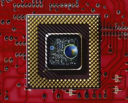 Close up of a globe in the center of a computer chip Stock Photos