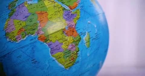 Close-up of globe with map of Africa and oceans on gray background. Stock Footage 255017490