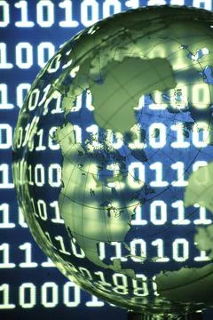 Close up of a globe superimposed over binary code 库存照片