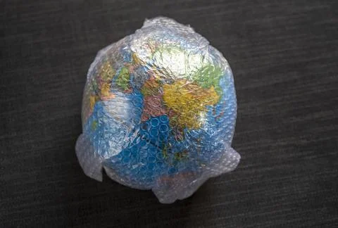 Close up of globe wrapped in bubble wrap plastc Stock Photos
