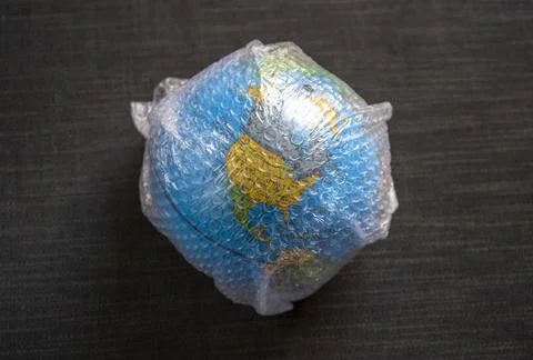 Close up of globe wrapped in bubble wrap plastc Stock Photos