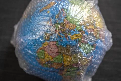 Close up of globe wrapped in bubble wrap plastc Stock Photos