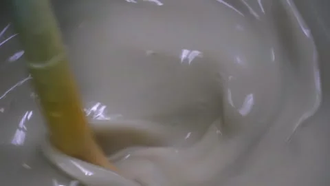Close-Up of Glossy White Starch Batter Being Mixed Stock Footage 340009449