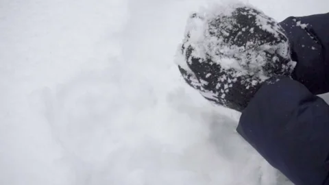 Close up of a gloved female hands making a snowball on a winter day Stock Footage 85050501