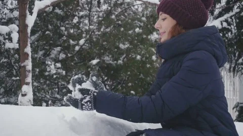 Close up of a gloved female hands making a snowball on a winter day Stock Footage 85050586