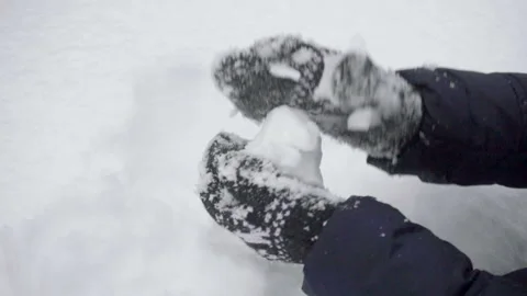 Close up of a gloved female hands making a snowball on a winter day Stock-Footage 85466157