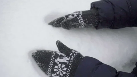 Close up of a gloved female hands making a snowball on a winter day Stock-Footage 86199040