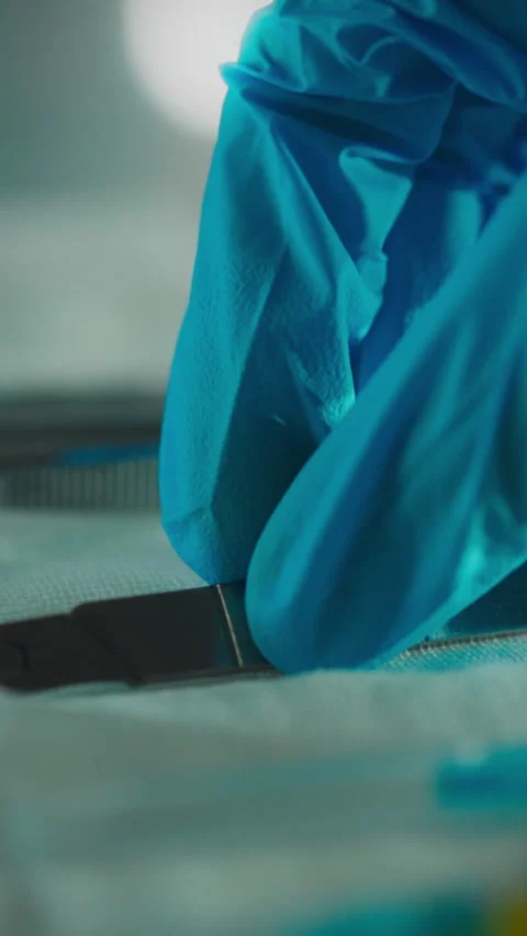 Close up of gloved hand carefully handling lab equipment in a scientific set Stock Footage 331538245