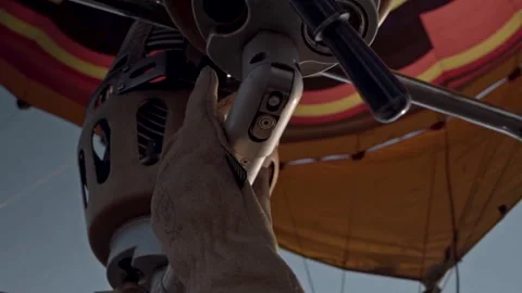 Close up of a gloved hand on the controls of a hot-air balloon Stock Footage 240921639