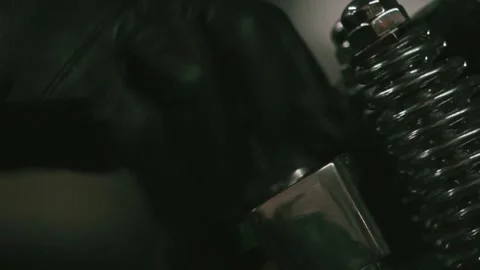 Close-Up of Gloved Hand Operating Metal Component in Industrial Workshop Stock Footage 303340817