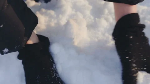 Close up, gloved hands making a snowball on a sunny winter day Stock Footage 114997684
