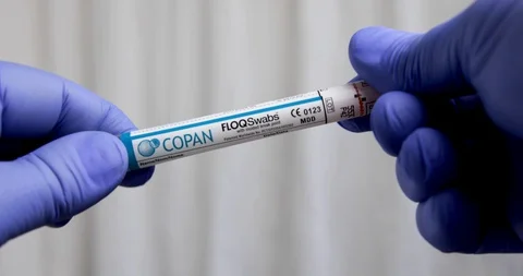 Close Up of Gloved Hands Opening COVID 19 Swab Stock Footage 129415468