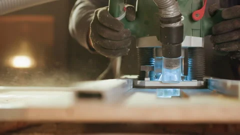 Close up of gloved hands operating woodworking machine with power tool over wood Vídeo Stock 347103693