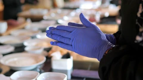 Close-up of gloved hands preparing a cutlet. Culinary academy. Stock Footage 154739981
