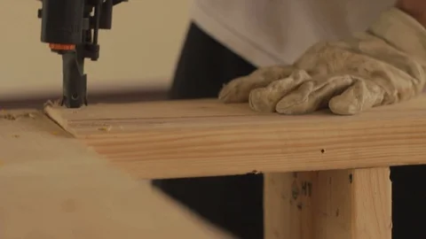 Close Up Gloved hands use nail gun on wood structure with sound 스톡 동영상 113809513