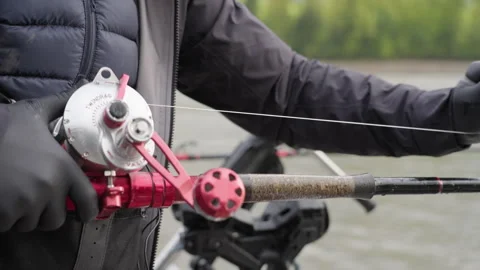Close Up Of Gloved Hands Working With A Heavy Duty Sport Fishing Rod And Reel Stock Footage 275064391